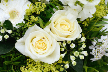bunch of flowers with white roses