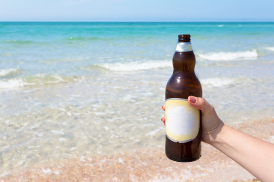 Beer bottle on a sandy beach