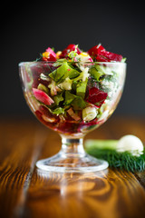 Salad from boiled beet with eggs and fresh vegetables