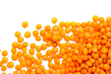 Red lentils on a white background