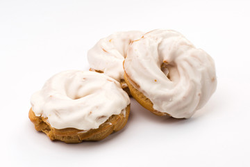 custard rings in white glaze with cream
