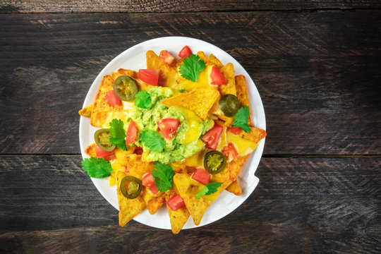 Nachos with cheese, traditional Mexican snack, with copyspace