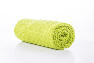 Green towel roll on white background