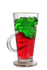 Fruit cocktail in a glass goblet on a white background