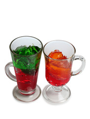 Fruit cocktail in a glass goblet on a white background