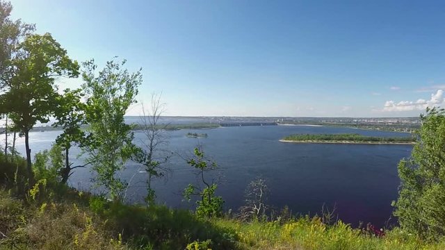 Young woman on the rocky Bank of the Volga river. Slowmotion
