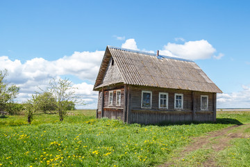 Obraz premium Rural house near the road in sunlight