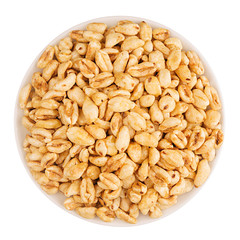 Puffed air rice wheat in bowl, top view, isolated on white background.