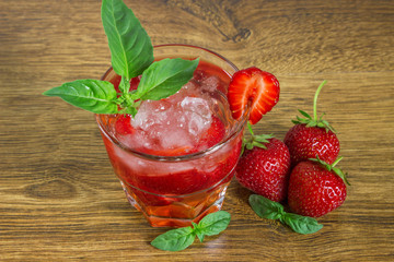 Strawberry iced drink in a wooden table