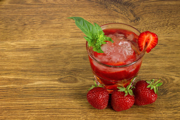 Strawberry iced drink in a wooden table