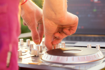 Obraz premium Dj mixing music outdoor.