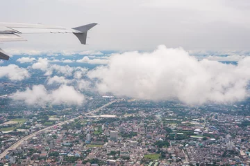 A cityscape view from the airplane window. © phichak