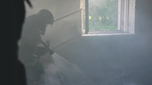 firefighter puts out fire