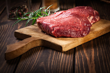 Fresh raw beef steak sirloin with rosemary