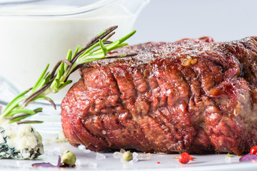 grilled beef steak at a white plate