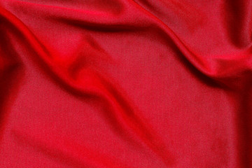 Red fabric pattern texture background, abstract background luxury cloth or liquid waves of grunge silk.