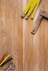 Ruler, pencil and other tools for creativity or work on a wooden table