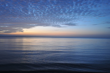 beautiful blue sky with clouds background.Sky clouds and sea, Sky with clouds weather nature cloud blue, Sky background on sunset, sunset at sea. variety of colors and hues of the rising sun