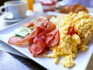 Breakfast with Prepared Egg and salad on table