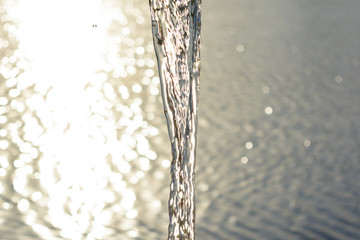 A stream of water against the background of the river