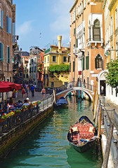 Fototapeta na wymiar beautiful landscape of the gondola on the canal in Venice, Italy, Europe.