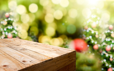 Empty wood plank food stand with blur Christmas tree bokeh light background,Template mock up for display or montage of product