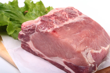 Raw pork chops with herbs and spices on cutting board. Ready for cooking.