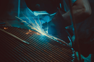 Welding Work. Erecting Technical Steel Industrial Steel Welder In Factory. Craftsman. Soft focus. Shallow DOF.