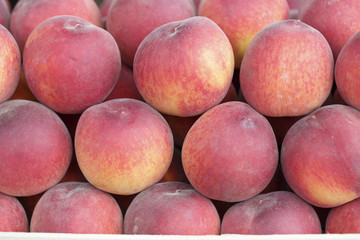 Peaches on the market, Colorful photo of peaches with defocused background, Selective focus with shallow depth of field