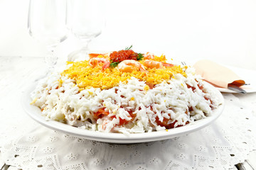 Salad of salmon and seafood on board