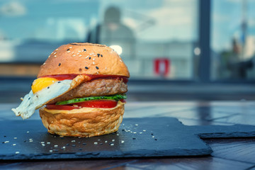 Delicious restaurant hamburger with fried egg