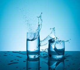 Creative splashing water in the glass