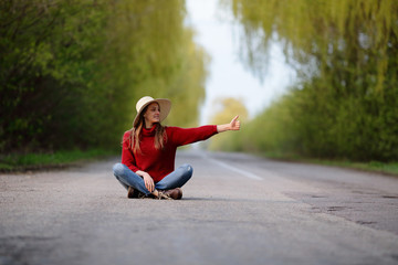 Fototapeta premium Woman sitting on road stopped cars, automatic braking gear, trraveling