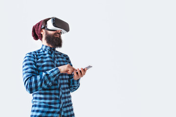 Smiling man with smartphone and VR glasses