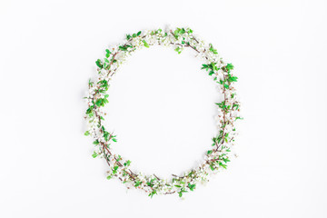 Flowers composition. Frame made of apple tree flowers on white background. Flat lay, top view