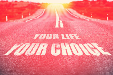 .Your Life Your Choice written on road. Selective focus. Toned.