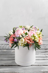 luxurious and elegant bouquet of roses and Other flowers. Composition colors on gray background. Copy space.