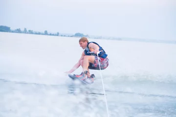 Zelfklevend Fotobehang  man is water skiing © yanlev