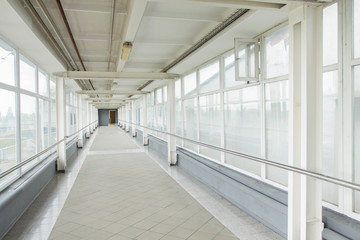 Image of big windows passing daylight inside office building