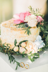 wedding cake decorated with fresh flowers
