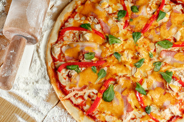 Baked pizza with ham and paprika and ingredients. Italian traditional food
