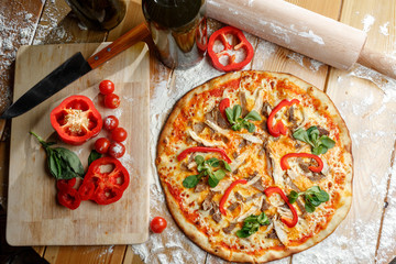 Baked pizza with chicken and paprika and ingredients. Italian traditional food