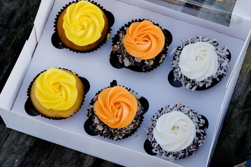 Cupcakes yellow,orange and white in white gift box