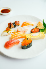 Raw and fresh nigiri sushi set in white plate