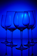 Set of wine glasses on blue background
