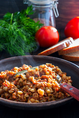 Italian small pasta with lentils and ham, selective focus