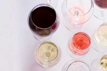 Set of glasses with red, white and rose wine, top view scene