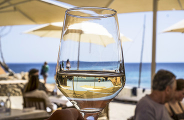 Sea view through the glass of wine
