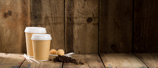 Ribbed Paper Cups Alongside Coffee Beans and Pastry Copy Space