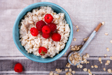 Oatmeal Porridge with fresh Berries,Raspberry.Breakfast.Concept of Healthy Eating. Copy space.selective focus.